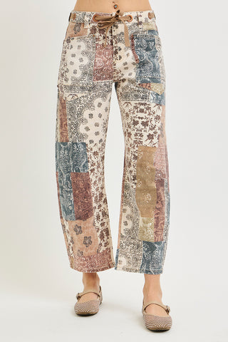 Patterned pants worn by a person on a white background